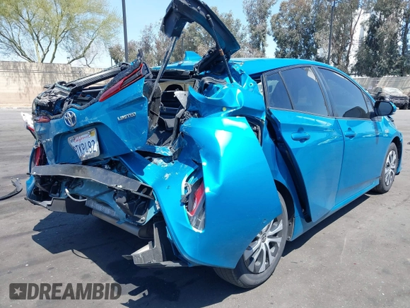 2021 Toyota Prius LE with VIN JTDKAMFP7M3169633, listed as a IAAI auction lot 41986170 with 55,925 mi miles and . Bid and sale history available at DreamBid. Image 4.