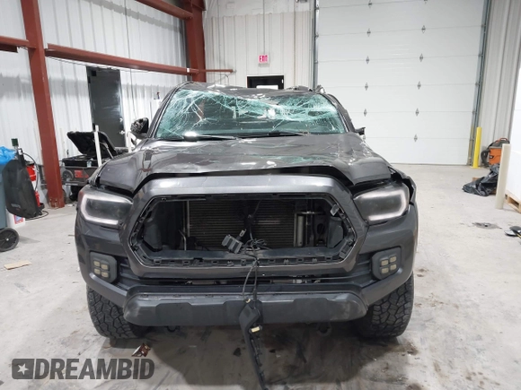 2021 Toyota Tacoma SR with VIN 3TYRX5GN8MT011370, listed as a IAAI auction lot 41287330 with 73,447 mi miles and . Bid and sale history available at DreamBid. Image 12.