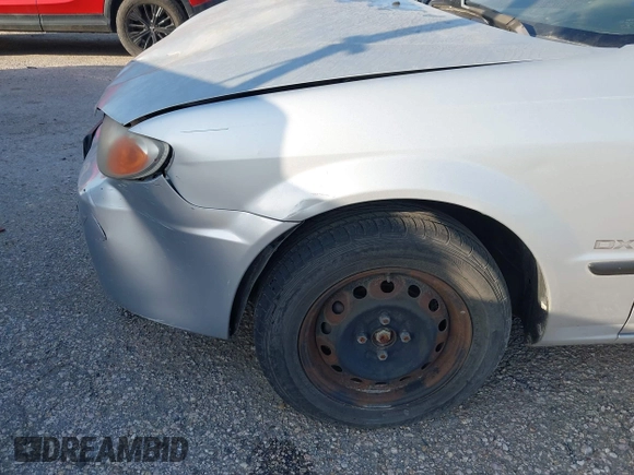 2001 Mazda Protege DX with VIN JM1BJ222810410482, listed as a IAAI auction lot 40799727 with 159,446 mi miles and . Bid and sale history available at DreamBid. Image 17.