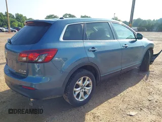 2014 Mazda CX-9 Touring with VIN JM3TB3CV7E0435659, listed as a IAAI auction lot 42428247 with 124,523 mi miles and . Bid and sale history available at DreamBid. Image 4.