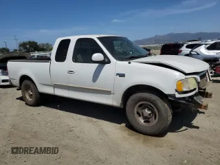 2003 Ford F-150 XL with VIN 2FTRX17213CA05950, listed as a Copart auction lot 54435115 with 310,503 mi miles and Salvage title. Bid and sale history available at DreamBid. Image 4.