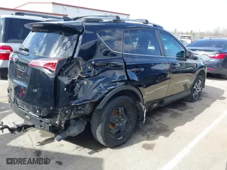 2018 Toyota RAV4 LE with VIN 2T3ZFREV9JW457062, listed as a IAAI auction lot 41696609 with 96,716 mi miles. Bid and sale history available at carsss.com. Image 4.