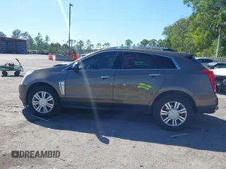 2014 Cadillac SRX Luxury Collection z VIN 3GYFNEE3XES587233, wystawiony jako IAAI lot #41747779 z przebiegiem 116 571 mil mil oraz . Historia ofert i sprzedaży dostępna na DreamBid. Obrazek 14.
