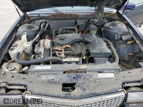 1990 Cadillac DeVille z VIN 1G6CD5337L4238206, wystawiony jako Copart lot #58214584 z przebiegiem Nie podano mil oraz Szkoda całkowita • Salvage title. Historia ofert i sprzedaży dostępna na DreamBid. Obrazek 11.