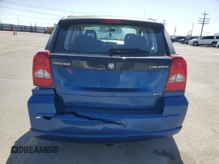 2009 Dodge Caliber SXT with VIN 1B3HB48A99D157051, listed as a Copart auction lot 52098965 with 188,268 mi miles and Salvage Title. Bid and sale history available at carsss.com. Image 6.