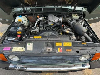1990 Land Rover Range Rover z VIN SALHV1249LA408661, wystawiony jako Copart lot #59861925 z przebiegiem 129 140 mil mil oraz Czysty tytuł • Clean title. Historia ofert i sprzedaży dostępna na DreamBid. Obrazek 5.