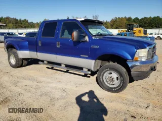 2003 Ford F-350 XL with VIN 1FTWW33P43EB78603, listed as a Copart auction lot 76317284 with 228,798 mi miles and Salvage Title. Bid and sale history available at DreamBid. Image 4.