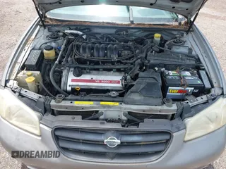 2000 Nissan Maxima GXE z VIN JN1CA31D0YT531421, wystawiony jako IAAI lot #42197398 z przebiegiem Nie podano mil oraz . Historia ofert i sprzedaży dostępna na DreamBid. Obrazek 10.