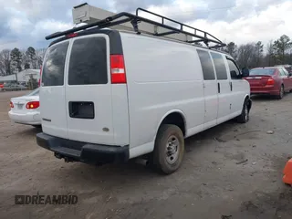 2017 Chevrolet Express Cargo Van with VIN 1GCWGBFG4H1348685, listed as a IAAI auction lot 41234959 with 215,067 mi miles. Bid and sale history available at carsss.com. Image 4.