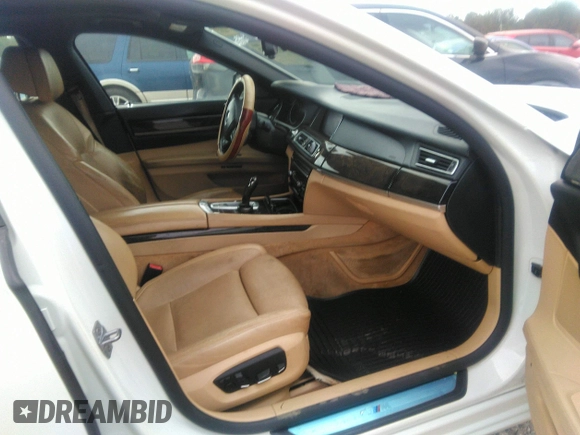2015 BMW 7 Series 750Li with VIN WBAYE8C50FD781160, listed as a IAAI auction lot 41061232 with 154,496 mi miles. Bid and sale history available at carsss.com. Image 5.