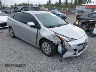 2016 Toyota Prius Two z VIN JTDKBRFU0G3013700, wystawiony jako IAAI lot #42474112 z przebiegiem 123 805 mil mil oraz . Historia ofert i sprzedaży dostępna na DreamBid. Obrazek 1.