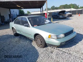 1989 Nissan Maxima z VIN JN1HJ01P5KT267358, wystawiony jako IAAI lot #42283788 z przebiegiem 152 298 mil mil oraz . Historia ofert i sprzedaży dostępna na DreamBid. Obrazek 1.