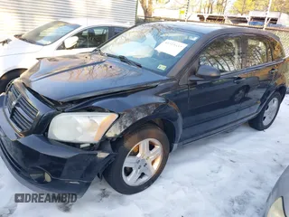 2009 Dodge Caliber SXT with VIN 1B3HB48A89D118869, listed as a IAAI auction lot 41315552 with 198,986 mi miles and . Bid and sale history available at DreamBid. Image 2.
