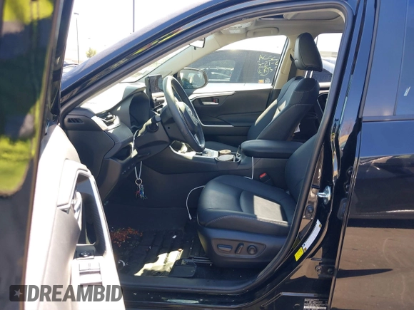 2024 Toyota RAV4 Hybrid XLE Premium with VIN JTMB6RFV0RD126685, listed as a IAAI auction lot 41870692 with 21,637 mi miles. Bid and sale history available at carsss.com. Image 5.