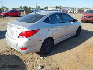 2015 Hyundai Accent GLS with VIN KMHCT4AE5FU808332, listed as a IAAI auction lot 42033625 with 195,433 mi miles. Bid and sale history available at carsss.com. Image 4.