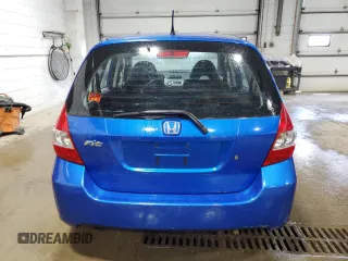 2007 Honda Fit with VIN JHMGD37447S041337, listed as a Copart auction lot 60352955 with 222,726 mi miles and Clean title. Bid and sale history available at DreamBid. Image 6.