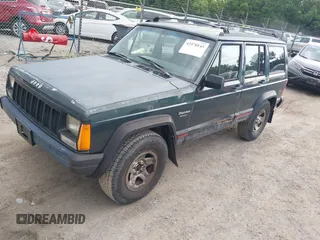 1993 Jeep Cherokee Sport with VIN 1J4FJ68S2PL622716, listed as a IAAI auction lot 42570145 with 183,159 mi miles and . Bid and sale history available at DreamBid. Image 2.