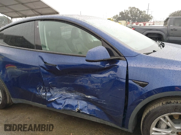 2022 Tesla Model Y Long Range with VIN 7SAYGDEE8NF511395, listed as a IAAI auction lot 41595310 with 65,156 mi miles and . Bid and sale history available at DreamBid. Image 6.