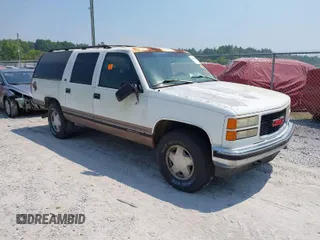 1996 GMC Suburban with VIN 1GKFK16R3TJ726521, listed as a IAAI auction lot 42055945 with 170,893 mi miles. Bid and sale history available at carsss.com. Image 1.
