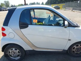2012 Smart fortwo Pure z VIN WMEEJ3BAXCK563660, wystawiony jako IAAI lot #42165195 z przebiegiem 53 809 mil mil oraz . Historia ofert i sprzedaży dostępna na DreamBid. Obrazek 14.