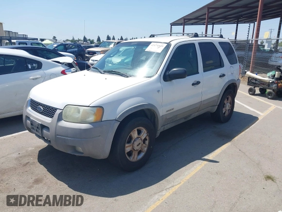 2001 Ford Escape XLT with VIN 1FMYU04131KB70753, listed as a IAAI auction lot 42174549 with 209,485 mi miles and . Bid and sale history available at DreamBid. Image 2.