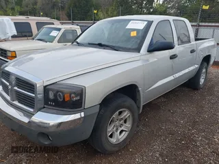 2005 Dodge Dakota SLT with VIN 1D7HE48K25S232893, listed as a IAAI auction lot 41932773 with 209,459 mi miles and . Bid and sale history available at DreamBid. Image 2.
