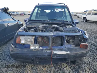1995 Suzuki Sidekick JX z VIN 2S3TD03V5S6403069, wystawiony jako Copart lot #80273204 z przebiegiem Nie podano mil oraz Szkody całkowita. Historia ofert i sprzedaży dostępna na DreamBid. Obrazek 5.