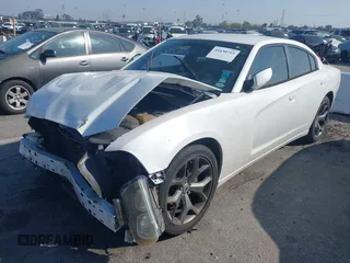 2013 Dodge Charger SE with VIN 2C3CDXBG2DH597792, listed as a IAAI auction lot 41630715 with 53,033 mi miles. Bid and sale history available at carsss.com. Image 2.