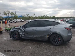 2024 Tesla Model Y Performance with VIN 7SAYGDEF3RA307468, listed as a IAAI auction lot 41805853 with 10,377 mi miles and . Bid and sale history available at DreamBid. Image 13.