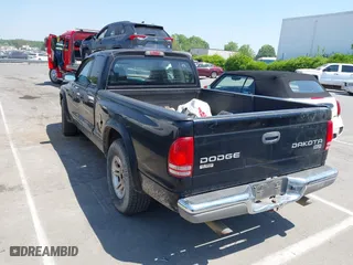 2004 Dodge Dakota SLT with VIN 1D7GL42N14S527342, listed as a IAAI auction lot 42081956 with 165,157 mi miles. Bid and sale history available at carsss.com. Image 3.