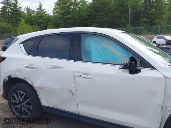 2018 Mazda CX-5 Grand Touring with VIN JM3KFBDM0J0308813, listed as a IAAI auction lot 42657978 with 78,119 mi miles and . Bid and sale history available at DreamBid. Image 6.