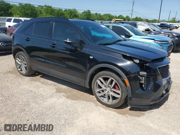 2021 Cadillac XT4 FWD Sport with VIN 1GYFZER44MF015908, listed as a Copart auction lot 52214925 with 94,079 mi miles and Clean Title. Bid and sale history available at carsss.com. Image 4.