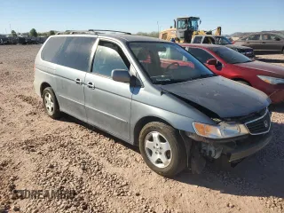 1999 Honda Odyssey EX with VIN 2HKRL1860XH541737, listed as a Copart auction lot 88897965 with 112,164 mi miles and Salvage title. Bid and sale history available at DreamBid. Image 4.