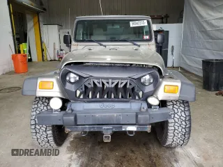 2005 Jeep Wrangler Sport z VIN 1J4FA49S75P325028, wystawiony jako Copart lot #56942315 z przebiegiem 169 988 mil mil oraz Szkoda całkowita • Salvage title. Historia ofert i sprzedaży dostępna na DreamBid. Obrazek 5.