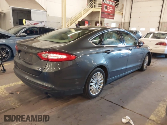 2016 Ford Fusion SE Hybrid with VIN 3FA6P0LU9GR235291, listed as a IAAI auction lot 41560312 with 112,777 mi miles. Bid and sale history available at carsss.com. Image 4.