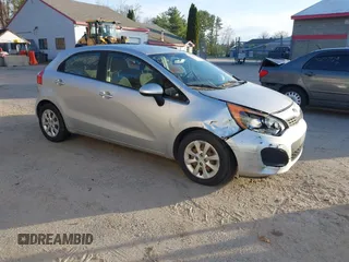 2013 Kia Rio LX with VIN KNADM5A32D6168492, listed as a IAAI auction lot 42144898 with 127,228 mi miles. Bid and sale history available at carsss.com. Image 1.