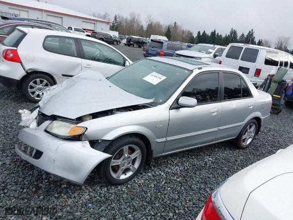 2003 Mazda Protege DX with VIN JM1BJ225330147296, listed as a IAAI auction lot 41484396 with 222,448 mi miles. Bid and sale history available at carsss.com. Image 14.
