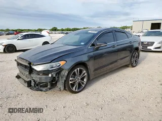 2020 Ford Fusion Titanium z VIN 3FA6P0D96LR128218, wystawiony jako Copart lot #57941685 z przebiegiem 90 360 mil mil oraz Szkoda całkowita • Salvage title. Historia ofert i sprzedaży dostępna na DreamBid. Obrazek 1.