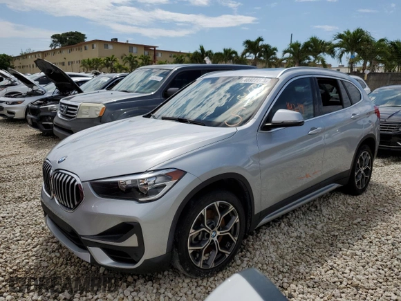 2021 BMW X1 sDrive28i with VIN WBXJG7C04M5S29295, listed as a Copart auction lot 48922203 with 14,214 mi miles. Bid and sale history available at carsss.com. Image 1.