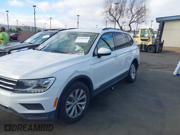 2019 Volkswagen Tiguan S with VIN 3VV1B7AX2KM039970, listed as a IAAI auction lot 41498706 with 56,907 mi miles and . Bid and sale history available at DreamBid. Image 14.