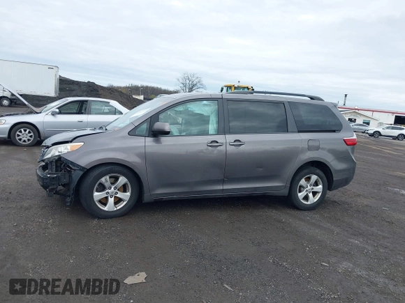 2015 Toyota Sienna LE AAS with VIN 5TDKK3DC1FS615090, listed as a IAAI auction lot 41965112 with 116,745 mi miles. Bid and sale history available at carsss.com. Image 14.