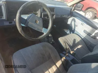 1986 Nissan Hardbody E z VIN 1N6ND16Y0GC394344, wystawiony jako Copart lot #86650524 z przebiegiem 122 949 mil mil oraz Tytuł czysty. Historia ofert i sprzedaży dostępna na DreamBid. Obrazek 8.