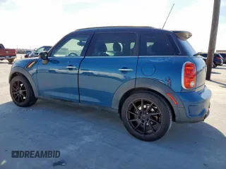 2012 MINI Countryman S with VIN WMWZC3C5XCWM27675, listed as a Copart auction lot 49676205 with 111,499 mi miles and Salvage title. Bid and sale history available at DreamBid. Image 2.