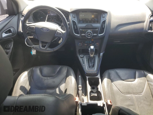 2016 Ford Focus Titanium z VIN 1FADP3J25GL201003, wystawiony jako Copart lot #53799745 z przebiegiem 194 055 mil mil oraz Szkoda całkowita • Salvage title. Historia ofert i sprzedaży dostępna na DreamBid. Obrazek 8.