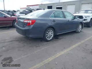 2012 Toyota Camry Hybrid XLE with VIN 4T1BD1FK9CU059021, listed as a IAAI auction lot 41932696 with 194,292 mi miles. Bid and sale history available at carsss.com. Image 4.