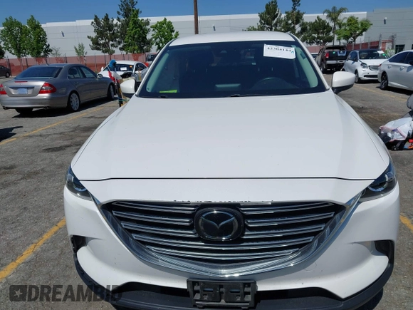 2020 Mazda CX-9 Sport with VIN JM3TCABY1L0406720, listed as a IAAI auction lot 42304144 with 75,887 mi miles and . Bid and sale history available at DreamBid. Image 12.
