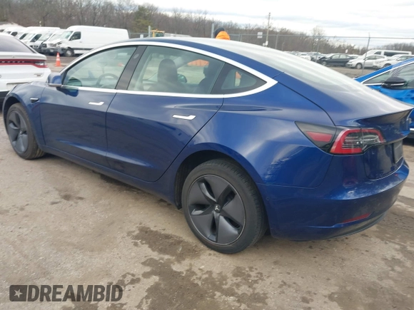 2019 Tesla Model 3 Mid Range with VIN 5YJ3E1EA5KF299589, listed as a IAAI auction lot 41709733 with 50,256 mi miles and . Bid and sale history available at DreamBid. Image 3.