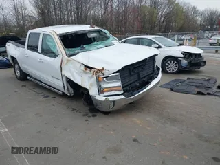 2018 Chevrolet Silverado 1500 LT with VIN 1GCUKREC0JF208509, listed as a IAAI auction lot 41794616 with 96,962 mi miles and . Bid and sale history available at DreamBid. Image 1.