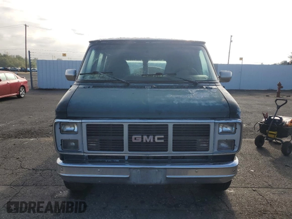 1991 GMC Vandura z VIN 1GDEG25K6M7504729, wystawiony jako Copart lot #71146614 z przebiegiem 181 800 mil mil oraz Tytuł czysty. Historia ofert i sprzedaży dostępna na DreamBid. Obrazek 5.