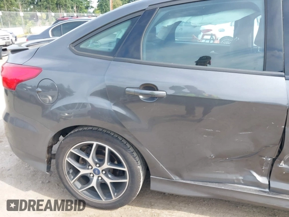 2015 Ford Focus SE with VIN 1FADP3F20FL269846, listed as a IAAI auction lot 42507197 with 143,496 mi miles and . Bid and sale history available at DreamBid. Image 14.